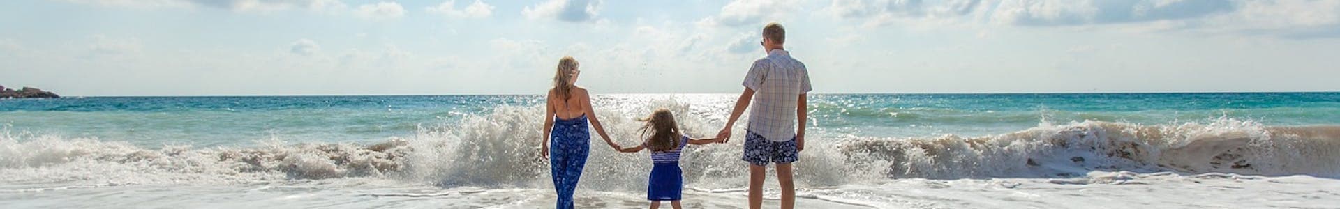 Family on beach - adoption & immigration