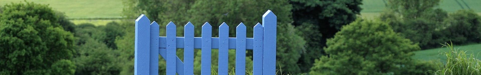 Blue gate in countryside - ancestry visa