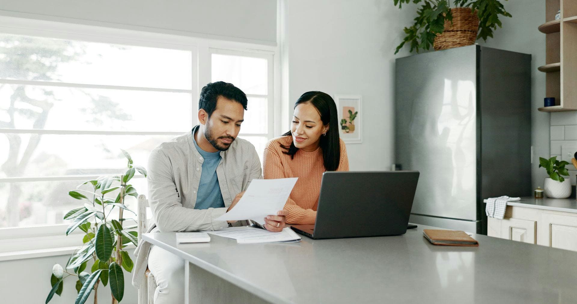 A couple reviewing their supporting documents